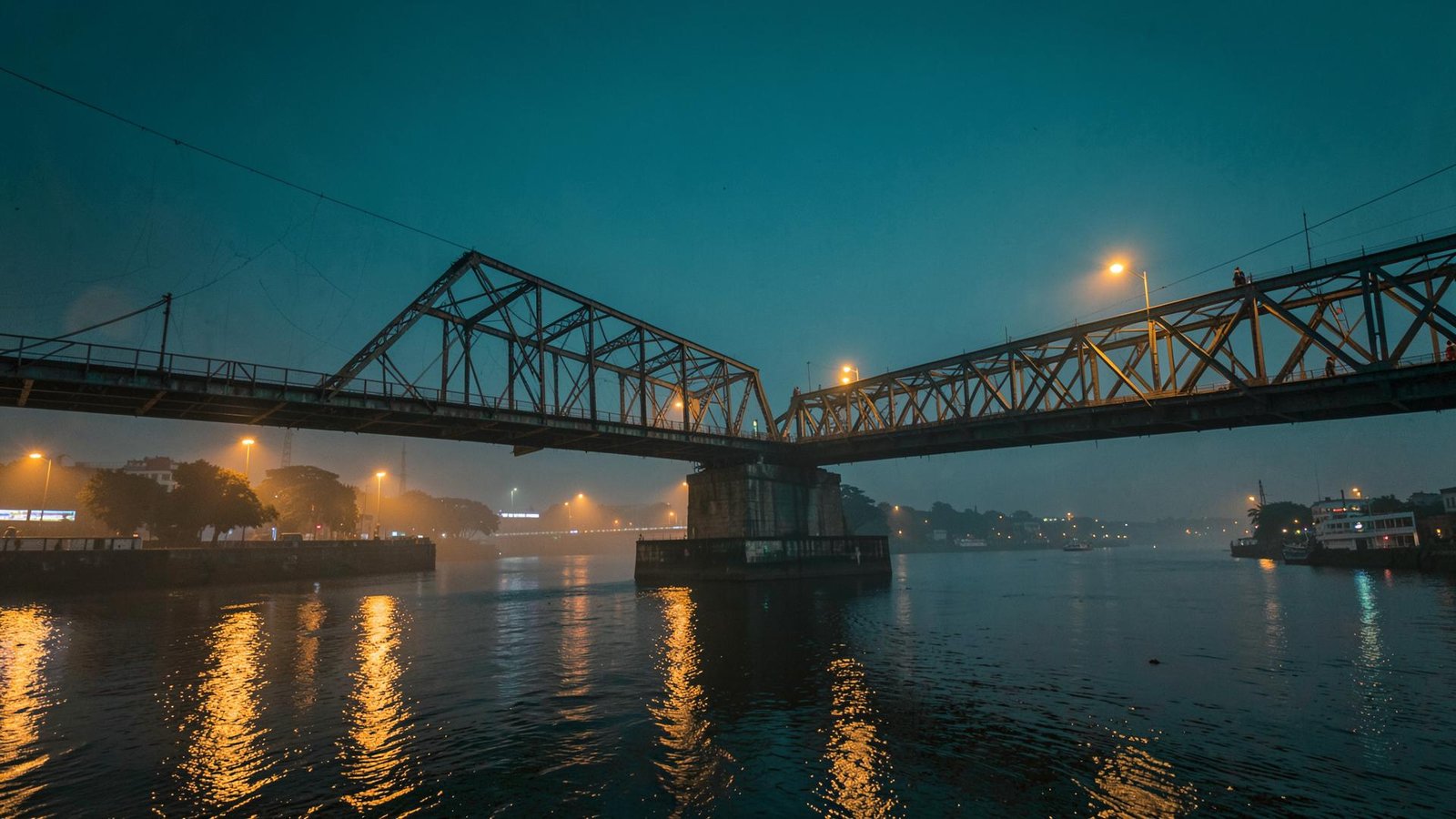 Howrah Bridge over the Hooghly river at dusk